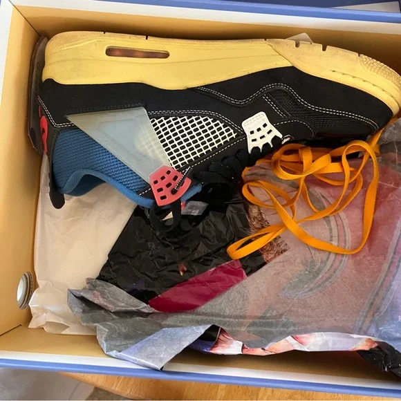 Air Jordan 4 Retro Low-Top in Black with Blue and Red Accents - Picture 10 of 11